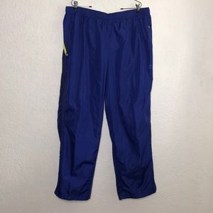 Men's blue sweat pants with stripes.